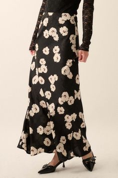 Floral-print maxi skirt. Floral jacquard fabric. Elastic waist. A-line silhouette. Partial thigh-length lining. Ankle length. Relaxed fit. 100% Polyester. Imported. Designed in LA. Model wears size S. Dark Florals Outfit, Elegant A-line Bottoms With Floral Print, Silk Floral Print Flowy Maxi Skirt, Floral Print Flared Evening Skirt, Evening Floral Print Flared Skirt, Chic Floral Print Fitted Maxi Skirt, Evening Flared Skirt With Floral Print, Elegant Floral Print Full Length Bottoms, Black Silk Maxi Skirt For Spring