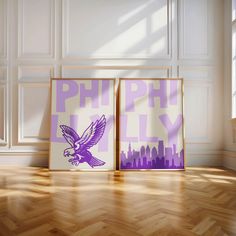 two purple and white posters sitting on top of a wooden floor