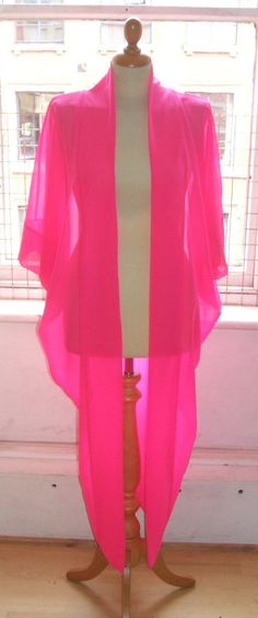 This listing is a gorgeous Maxi Kimono in Pink ChiffonBeautiful Kimono! Elbow length sleeves and a lovely relaxed, oversize cut.We also make a shorter version of this top xWe can make this kimono with long sleeves on request.Looks fantastic dressed down with shorts and a cute top, or over a LBD for a stunning evening look xLength is 50" from the shoulder.Like us on Facebook  'Baylis and Knight' to enter our fabulous competitions and upload pictures of you wearing your favourite B&K designs!! Summer Wedding Open Front Kimono, Pink Party Kimono, Spring Wedding Open Front Kimono, Sheer Kimono With Kimono Sleeves For Summer, Pink Spring Party Kimono, Spring Party Pink Kimono, Fitted Pink Summer Kimono, Fitted Wrap Kimono For Party, Pink Long Sleeve Kimono For Party