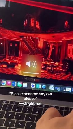 someone is typing on their laptop with a red light coming from the screen that says please hear me say ow