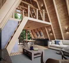 a living room filled with furniture and lots of wooden beams on the wall above it