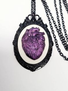 JUST LISTED Purple Iridescent Heart Anatomy Gothic Rockabilly Cameo black Necklace Pendant Victorian Jewelry Broock Pin Hand painted cameo If you are wanting a specific color please feel free to contact me and I will do my best to create what you are searching for. Victorian Jewelry substantial in size at just a little over 2 INCHES Long Center is 40mmx30mm **MATCHING ITEMS IN OUR STORE BADGE HOLDER BROOCH HAIR PINS - CLIPS** **thank you for taking the time to look at our items. Each item is han Purple Gothic Jewelry For Formal Occasions, Purple Victorian Necklace For Gift, Gothic Purple Jewelry Gift, Gothic Purple Jewelry For Halloween, Gothic Rockabilly, Gothic Purple Necklace For Halloween, Goth Things, Heart Anatomy, Jewelry Brooch