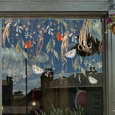 an image of a window with flowers on it