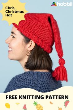 a woman wearing a red knitted hat with tassels