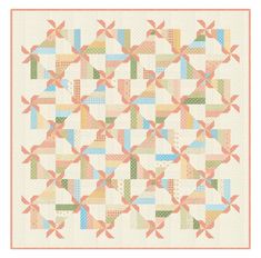 a quilt with many different colors and patterns on the front, along with a white background