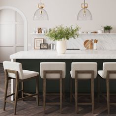 a kitchen with marble counter tops and bar stools