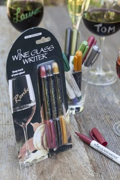 some wine glasses and markers on a table