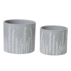 two gray planters sitting next to each other