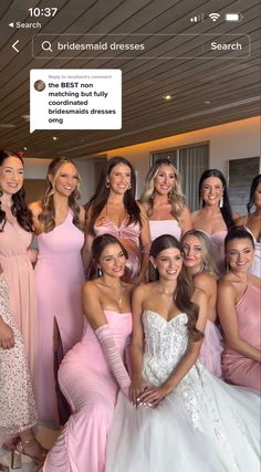 the bridesmaids are all dressed in pink dresses and posing for a group photo