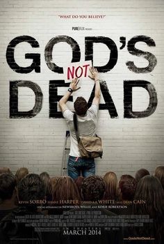 a man standing in front of a wall with the words god's not dead written on it