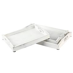 two white trays with handles on each side