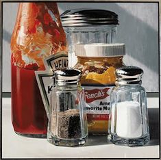 three jars filled with different types of spices