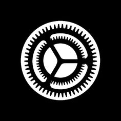 a black and white clock with gears in the shape of a circle on a dark background