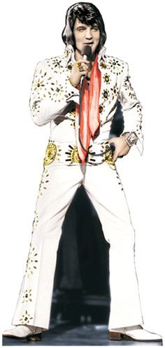 elvis presley standing on stage with microphone in his hand and wearing white suit, red tie