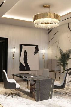 an elegant dining room with chandelier and art work on the wall behind it