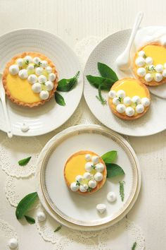 three plates with small desserts on them