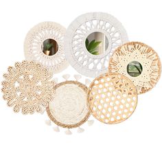 several white and beige plates with designs on them