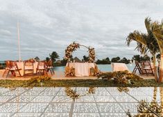 an outdoor wedding set up with tables and chairs