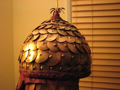 a lamp that is sitting on top of a wooden table in front of a window