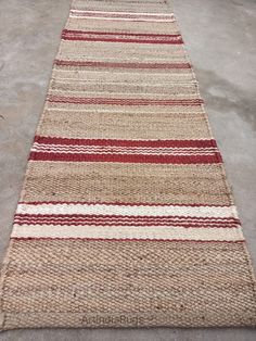 a striped rug is laying on the ground