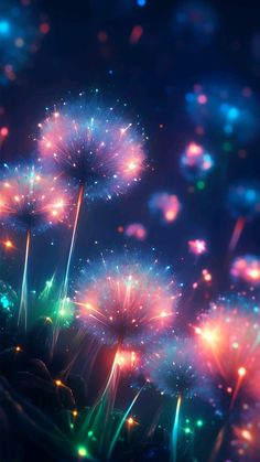 fireworks are lit up in the night sky with colorful lights on them and sparkles