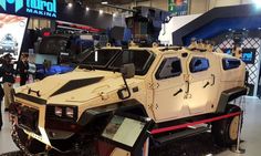 an armored vehicle is on display at the convention