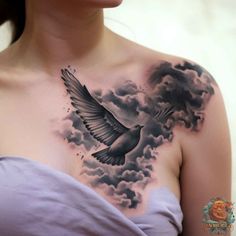 a woman with a bird tattoo on her chest