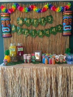 a tiki themed birthday party with food and decorations