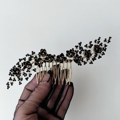 With its elegant and striking design, this hair comb complements your special occasions. Featuring black floral details and gothic elements, it's the perfect choice for weddings and events like Halloween. 🎃 This handmade accessory, with an Evil Queen theme, is ideal for adorning the hair of brides and guests alike. 👑 Our hair comb, known for its unique design and quality craftsmanship, adds a mystical touch to your style. ✨ The Bride Vine Comb blends both classic and modern styles seamlessly. Details 🧐 *Our products are handmade and available for worldwide shipping. *We used gold colored jewelry wire. *We used crystal beads on the branches. *We created and painted the flowers by dipping them in a special type of resin. *"We designed it to be approximately 18 cm ( 7,09 inches) in length Black Hair Accessories, Gothic Elements, Gothic Flowers, Gothic Hairstyles, Flower Comb, Evil Queen, Dark Floral, Bridal Hair Pieces, Bridal Hair Accessories