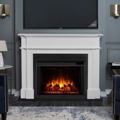 a fireplace with a flat screen tv above it