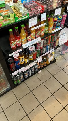 an assortment of condiments on display in a grocery store