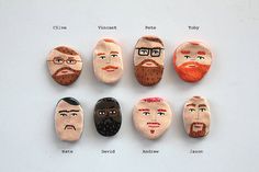 six rocks with different faces are arranged in the shape of men's heads and beards