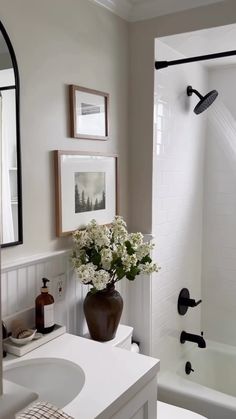 a bathroom with a sink, toilet and bathtub