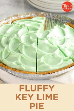 there is a pie with green frosting on it and the words fluffy key lime pie