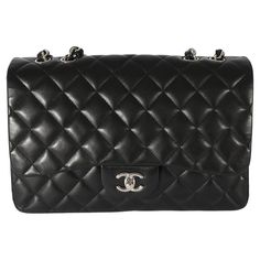 Listing Title: Chanel Black Lambskin Jumbo Single Flap Bag SKU: 128457 Condition: Pre-owned Condition Description: A timeless classic that never goes out of style, the flap bag from Chanel dates back to 1955 and has seen a number of updates. The design was revolutionary for its time, giving its wearers the freedom to carry their everyday must-haves without the cumbersome nature of a larger bag. The bag features the classic leather-entwined chain-link shoulder strap for a distinctive aesthetic. H Chanel Jumbo, Chanel Model, Black Exterior, Chanel Black, Large Bag, Classic Leather, Flap Bag, Primavera Estate, Timeless Classic