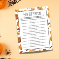 a paper with the words pass the pumpkin written on it next to some halloween decorations