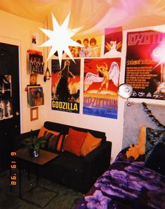 a living room with posters on the wall