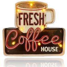 a sign that says fresh coffee house with a cup on it's side and lights around the edge