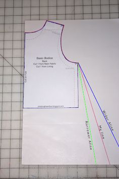 a piece of paper that has been cut out to make a dress pattern on it