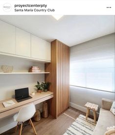 a room with a desk, chair and laptop on it