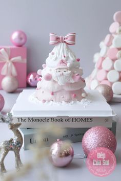 the monocle book of homes is sitting on top of a table next to ornaments