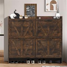 a large wooden cabinet sitting on top of a hard wood floor next to a white rug