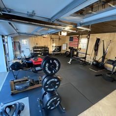 an empty gym with weight machines and other equipment