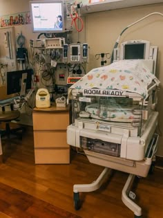 a hospital room filled with medical equipment and monitors