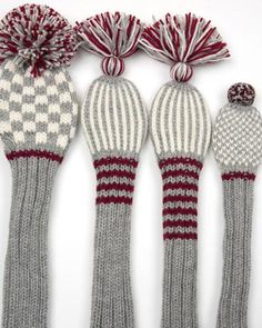 four knitted mittens lined up next to each other