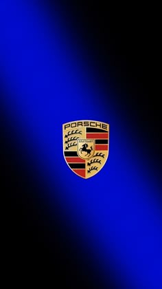 a blue and black background with the emblem of a porsche car on it's side