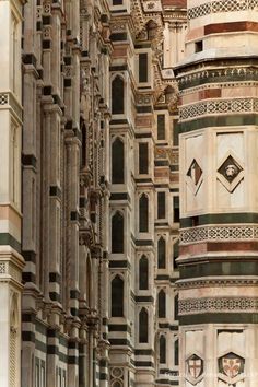 an ornate building with many windows and arches