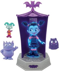 the figurines are all in different colors and sizes, including one with a bat costume