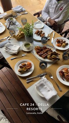 the table is set for two people to enjoy their meal, and they are ready to eat