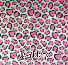 purple and black leopard print fabric with the words le adore on it in white